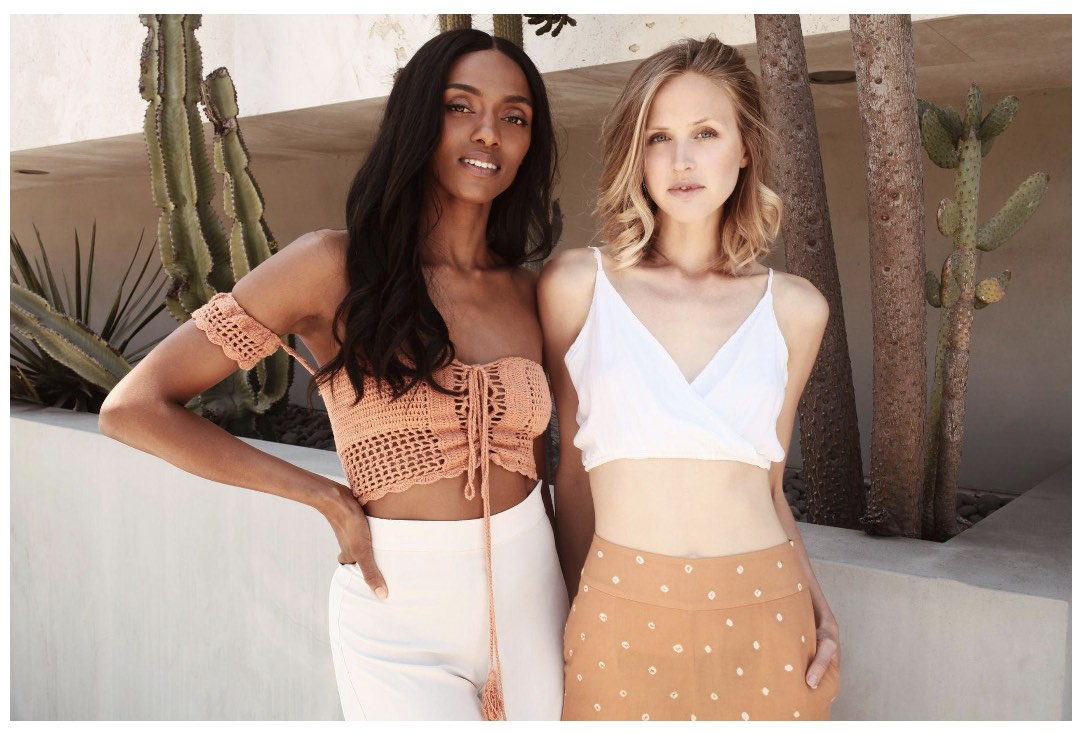 Two young women posing.